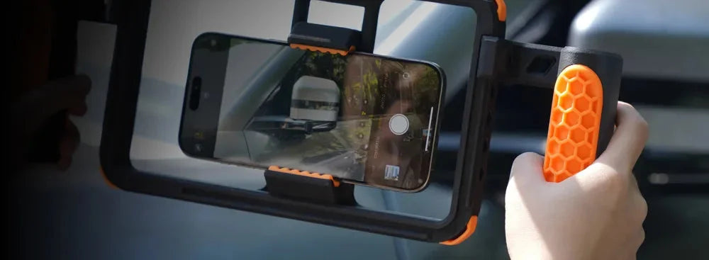 Bambu Lab H2D ile üretilmiş, turuncu detaylı ergonomik video çekim rigi ve akıllı telefon sabitleyici aparat. Timuzon güvencesiyle hemen keşfedin.